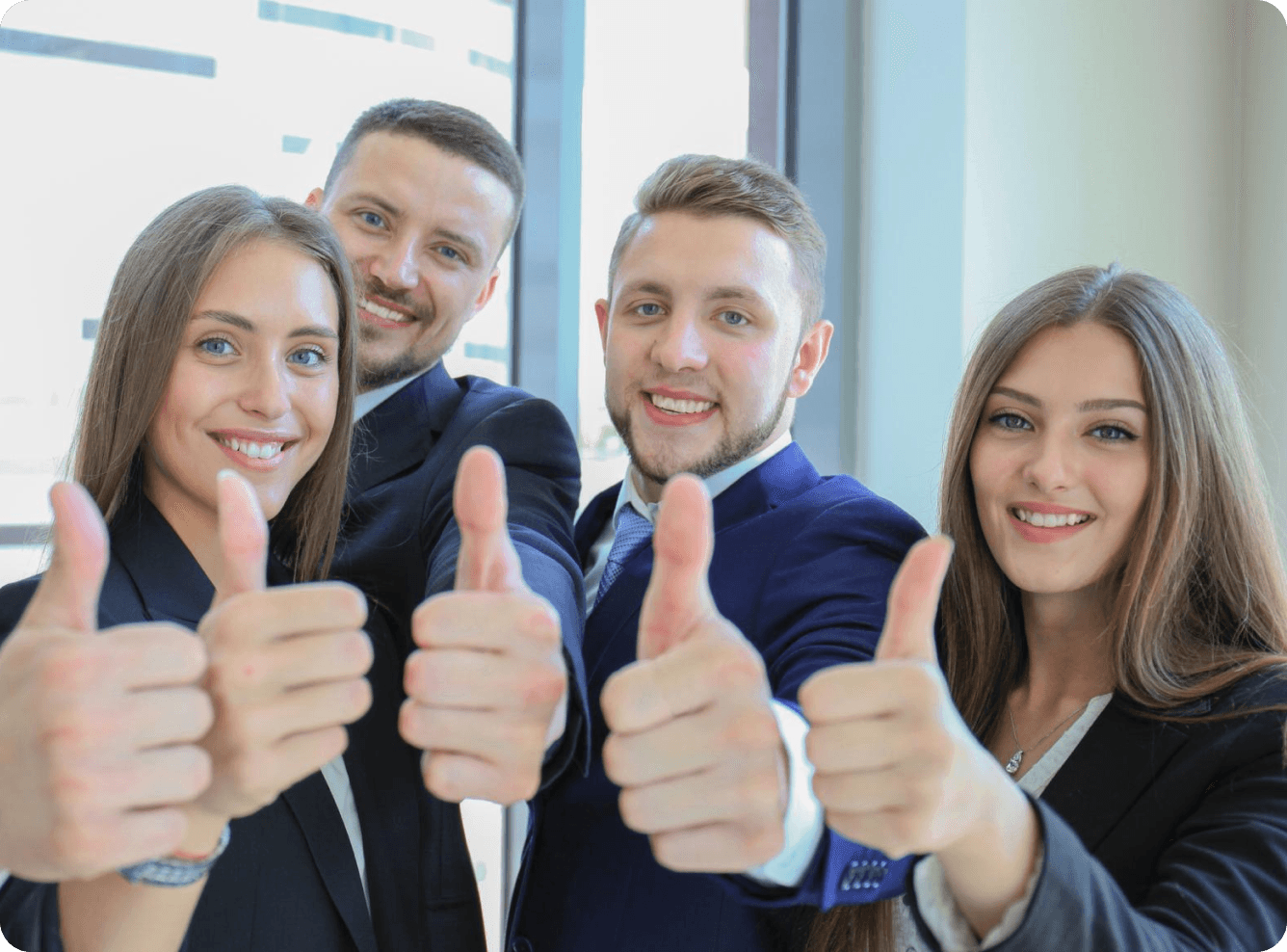 Successful business clients giving thumbs up