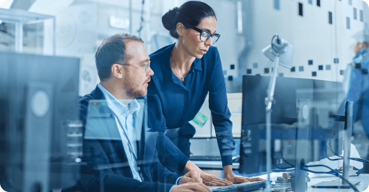 IT technicians reviewing code and server diagnostic dashboards